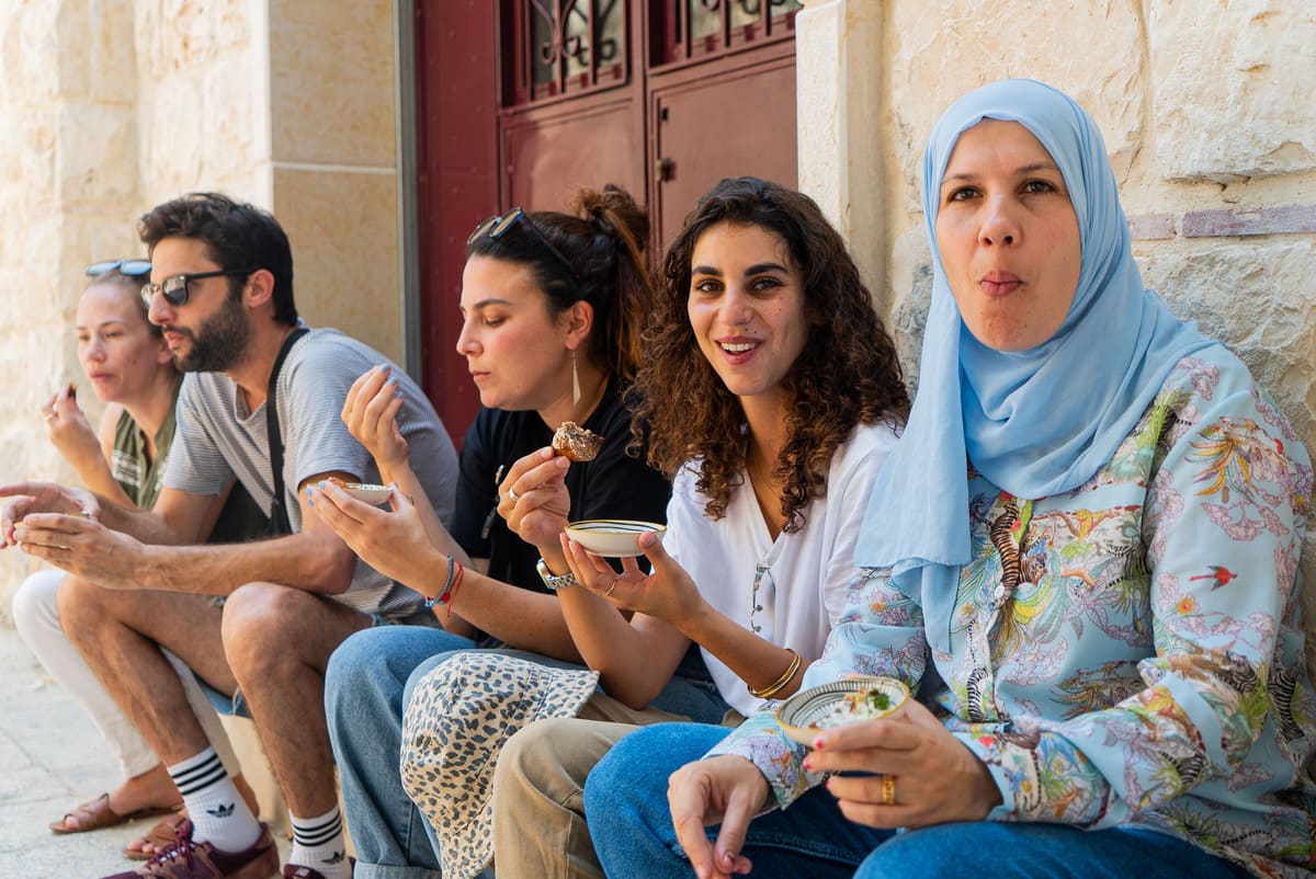 People eat on a tour in Nazareth