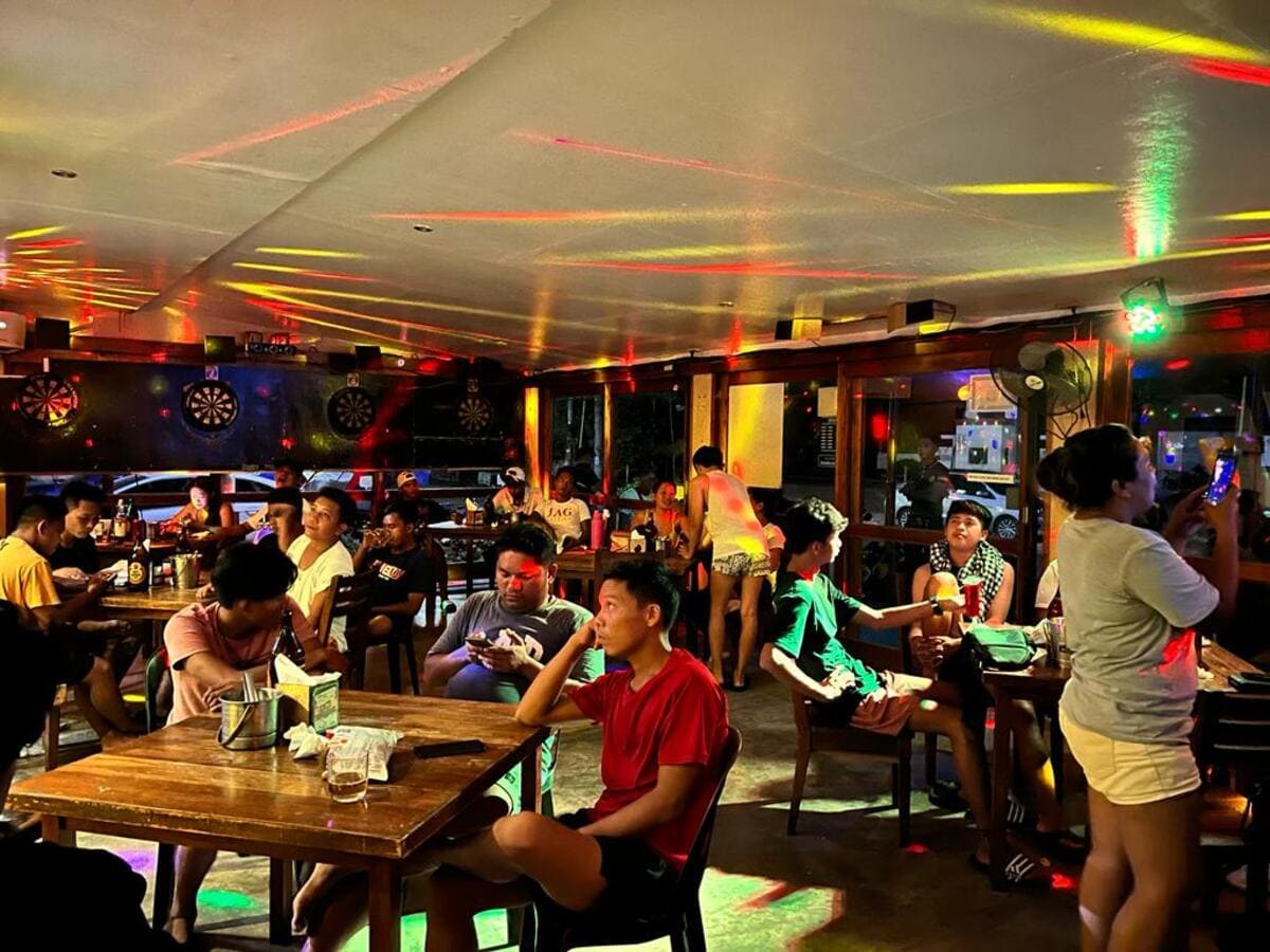 People are sitting in a pub in the Philippines